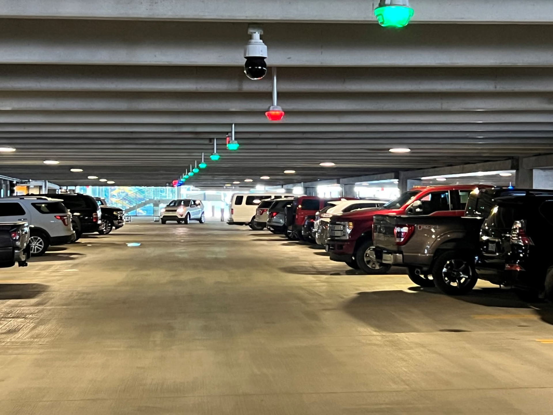 Parking garage deck with overhead occupancy indicators and lighting installed by Max Electric